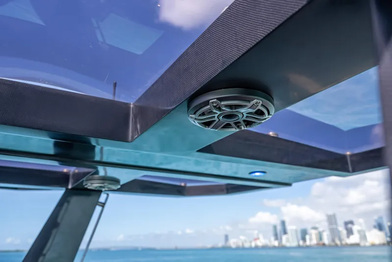 Slide: The Image of Wally 43 yacht detail, showcasing speaker and sleek design against city skyline, 2012 model. - 13
