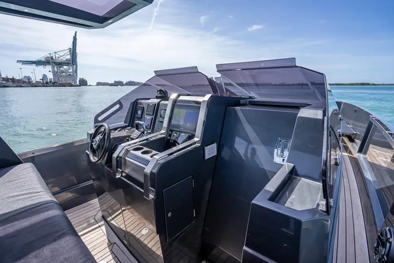Slide: The Image of Modern Wally 43 yacht cockpit with advanced navigation systems, docked by the sea, 2012 model. - 16