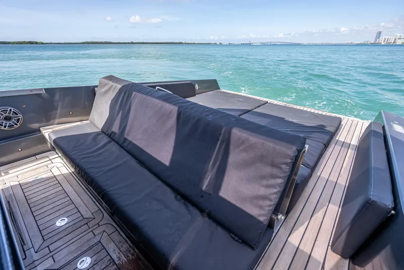 Slide: The Image of Luxury Wally 43 yacht deck with seating, 2012 model, overlooking serene ocean waters. - 19