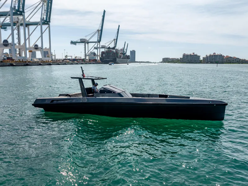 Slide: The Image of Wally 43 yacht from 2012 on a sunny day in a harbor. - 2