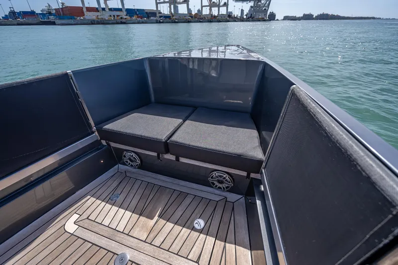 Slide: The Image of Luxurious 2012 Wally 43 yacht interior with cushioned seating and wooden deck. - 23