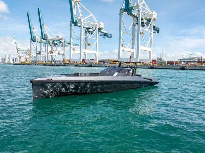 Slide: The Image of Wally 43 yacht from 2012 in a port with cranes in the background. - 3