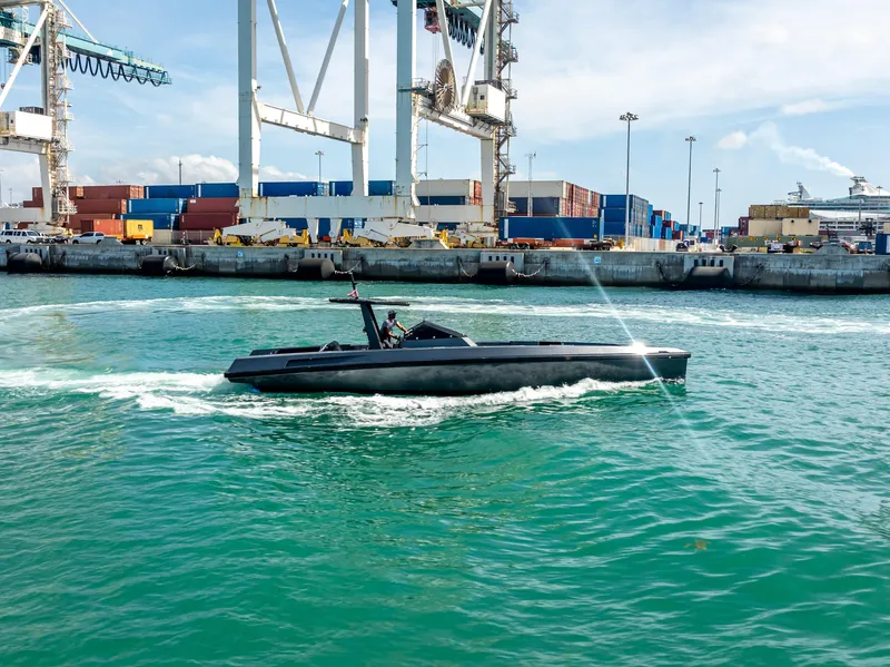 Slide: The Image of Sleek Wally 43 boat cruising near industrial port, 2012 model. - 4