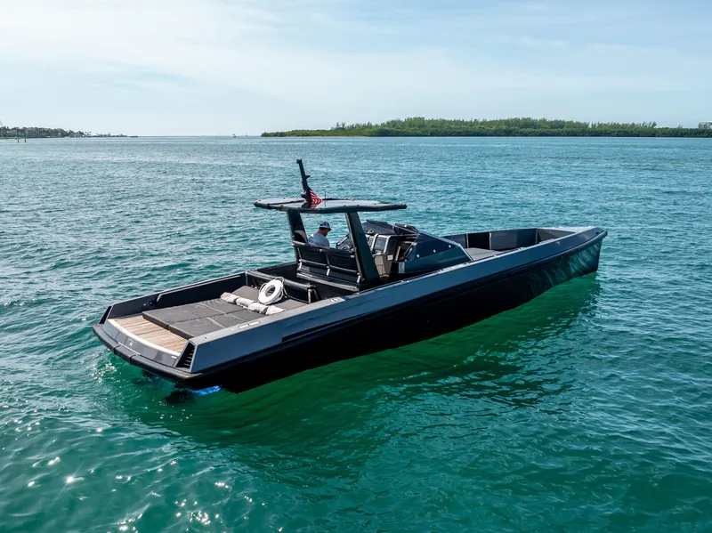 Slide: The Image of Sleek 2012 Wally 43 boat cruising on clear blue water. - 9