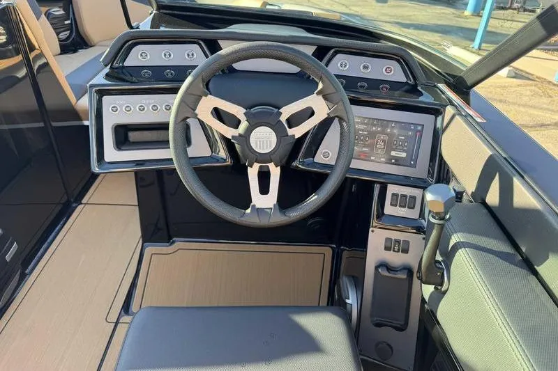 Slide: The Image of 2026 MasterCraft NXT23 boat interior with tan seating and modern design. - 7