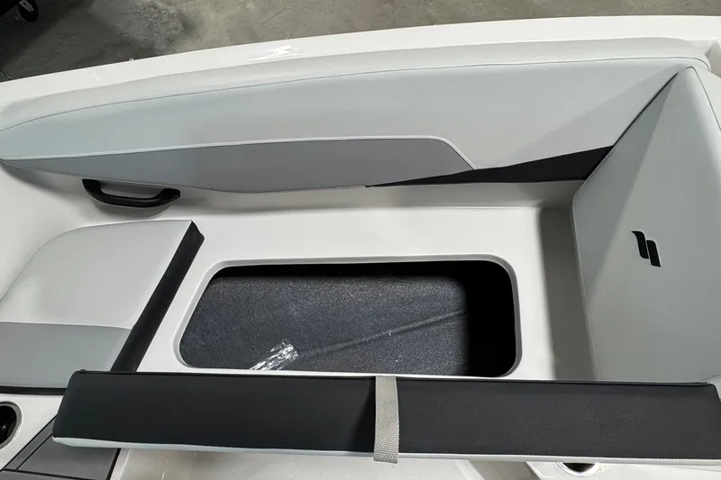 Slide: The Image of 2026 Starcraft SV 16 OB boat interior with open storage compartment. - 14