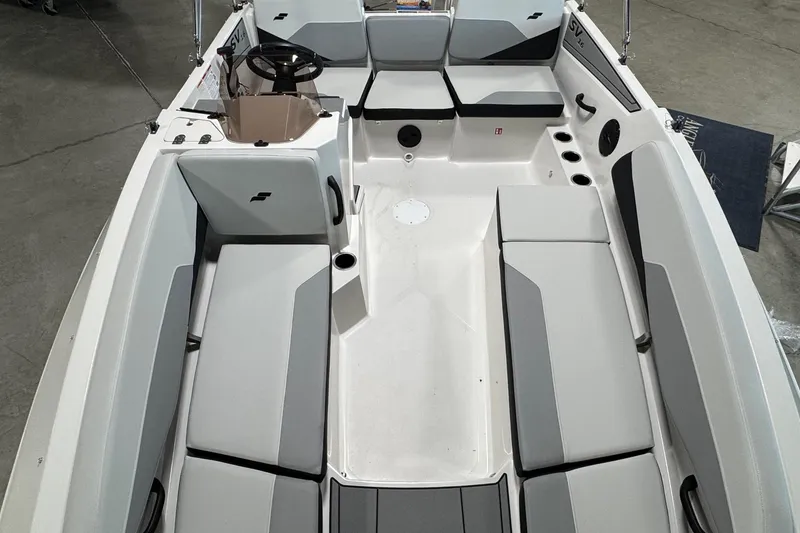Slide: The Image of 2026 Starcraft SV 16 OB boat interior with gray seating and steering wheel. - 15