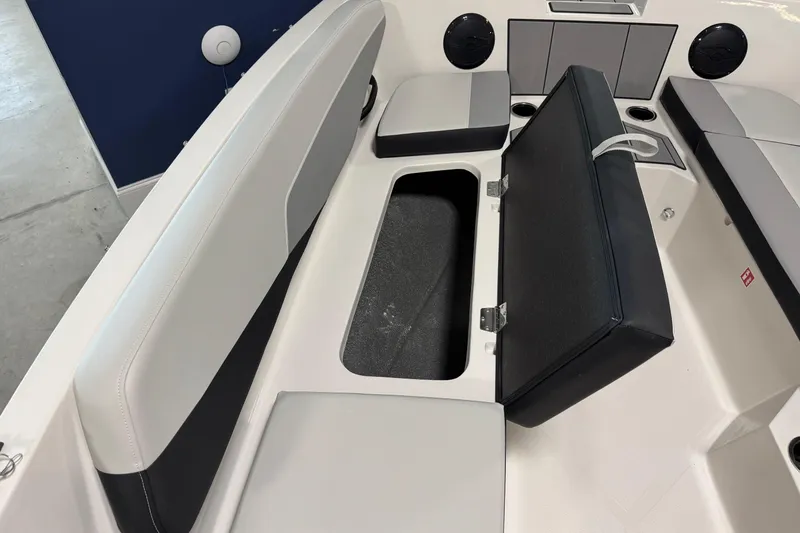 Slide: The Image of 2026 Starcraft SV 16 OB boat interior with open storage compartment and cushioned seating. - 19