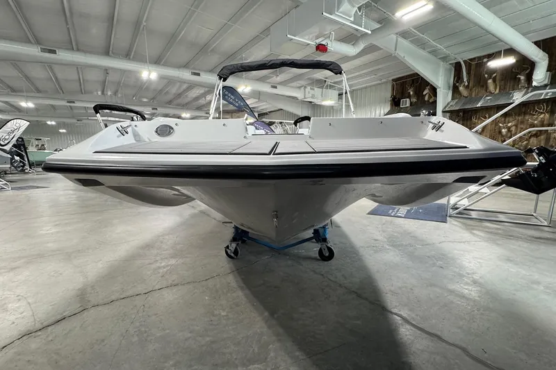 Slide: The Image of 2026 Starcraft SV 16 OB boat displayed indoors, showcasing sleek design and modern features. - 4