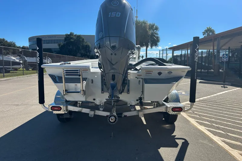 Slide: The Image of Avid 21 FST 2025 boat on trailer, rear view with Yamaha 150 engine. - 5