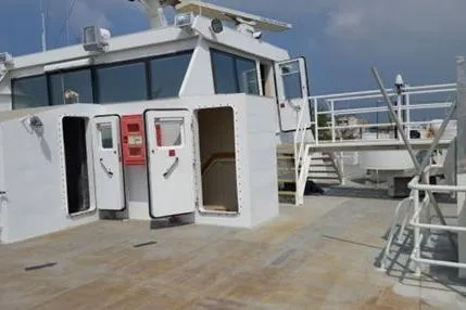 Slide: The Image of FBMA Philippines 2006 SWATH Slice Crew Transport Vessel deck with open doors and stairs. - 18