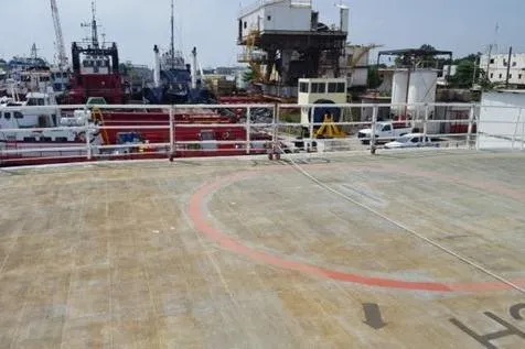 Slide: The Image of Helipad on FBMA Philippines SWATH Slice Crew Transport Vessel, 2006, docked at a busy shipyard. - 19