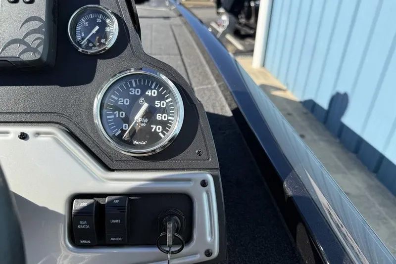 Slide: The Image of 2018 Ranger RT198P boat storage compartment with key lock, open and empty. - 13