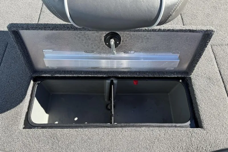 Slide: The Image of 2018 Ranger RT198P boat storage compartment with open lid, showing interior space. - 26