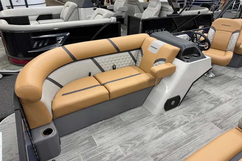 Slide: The Image of 2025 Crest Classic 220 boat interior with tan seating and modern design. - 3