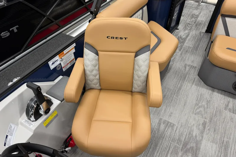 Slide: The Image of Crest Classic 220 boat seat, 2025 model, featuring tan upholstery and modern design. - 5