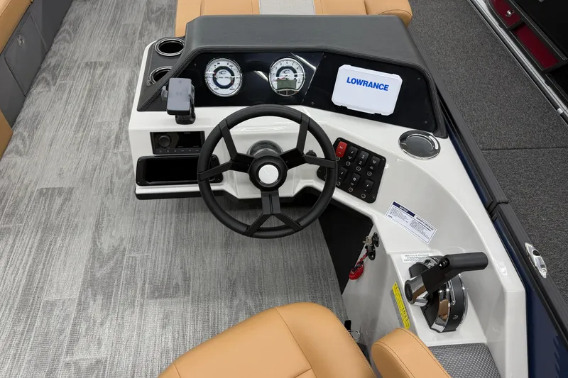 Slide: The Image of 2025 Crest Classic 220 boat dashboard with steering wheel and Lowrance display. - 6