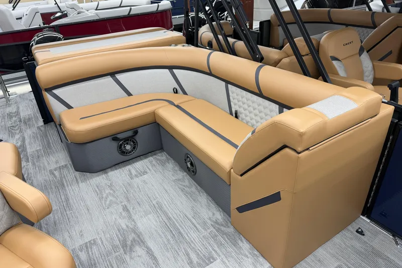 Slide: The Image of Luxurious seating on 2025 Crest Classic 220 boat, featuring tan upholstery and modern design. - 7