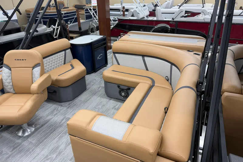 Slide: The Image of Luxurious interior of 2025 Crest Classic 220 pontoon boat with tan seating and modern design. - 8