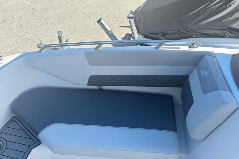 Slide: The Image of 2026 Starcraft SVX 171 OB boat interior with cushioned seating and sleek design. - 12