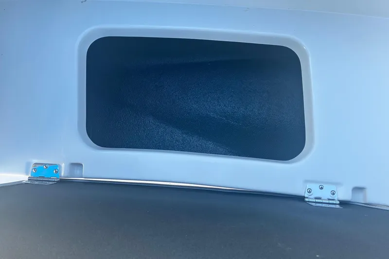 Slide: The Image of Storage compartment in 2026 Starcraft SVX 171 OB boat, featuring a sleek design. - 14