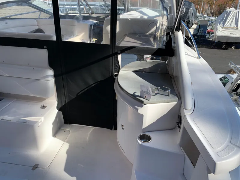 Slide: The Image of 2009 Regal 4460 yacht interior with seating and helm station. - 14