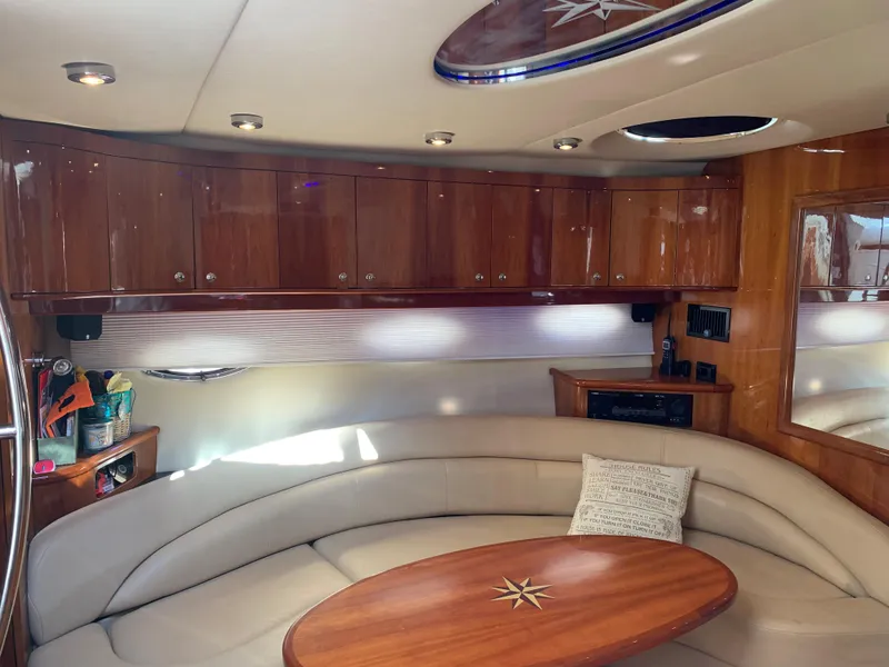 Slide: The Image of Luxurious interior of a 2009 Regal 4460 yacht with leather seating and wooden cabinetry. - 32