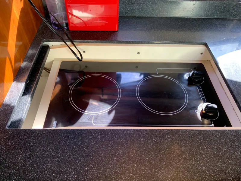 Slide: The Image of Built-in electric cooktop on a 2009 Regal 4460 yacht kitchen. - 35