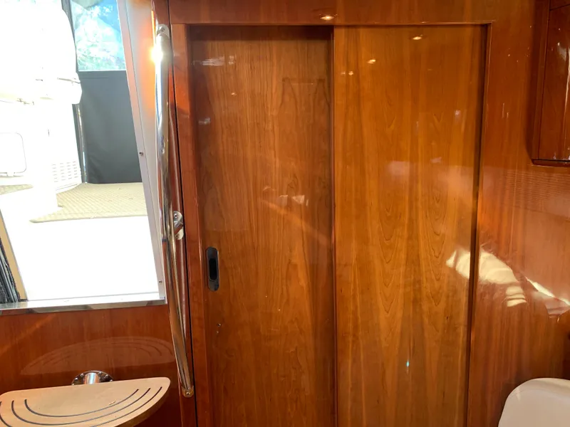 Slide: The Image of Interior of 2009 Regal 4460 yacht with wooden sliding door. - 39
