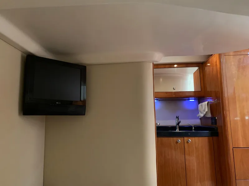 Slide: The Image of Interior of 2009 Regal 4460 yacht with TV and kitchenette. - 47