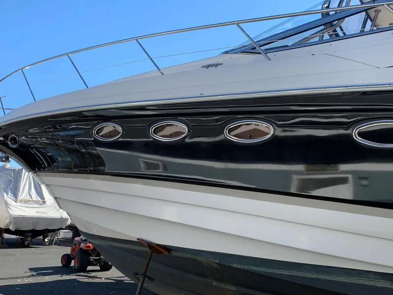 Slide: The Image of 2009 Regal 4460 yacht side view in a marina. - 6