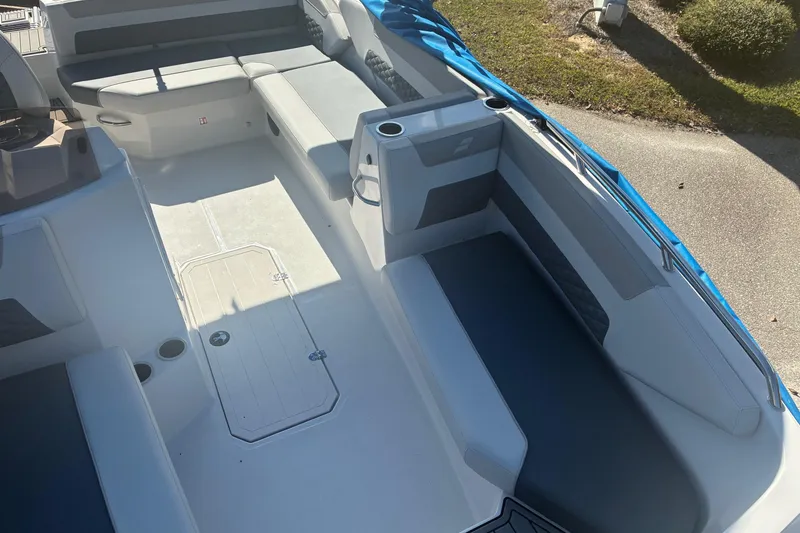 Slide: The Image of 2026 Starcraft SVX 171 OB boat interior with spacious seating and storage compartments. - 11