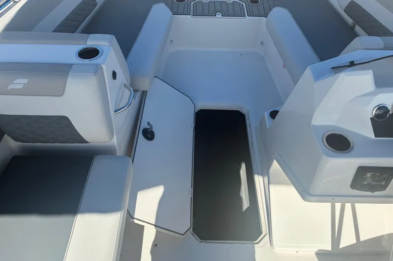 Slide: The Image of 2026 Starcraft SVX 171 OB boat interior with seating, storage, and cup holders. - 5