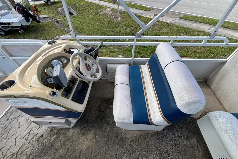 Slide: The Image of 2005 Bentley Pontoons 200 Fish interior with steering console and seating. - 14