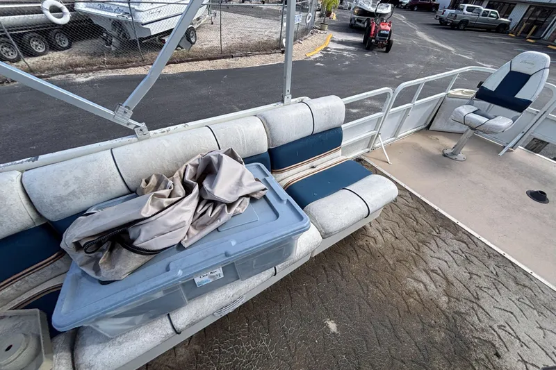 Slide: The Image of 2005 Bentley Pontoons 200 Fish interior with seating and storage container. - 17