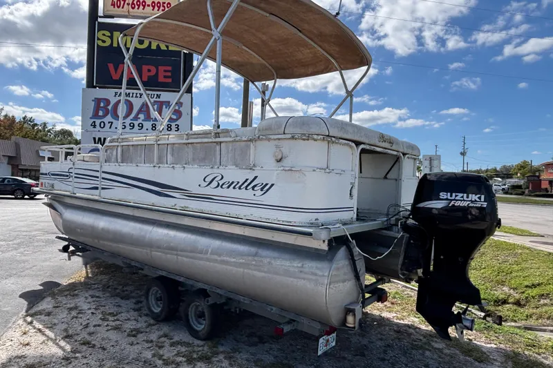 Slide: The Image of 2005 Bentley Pontoons 200 Fish with Suzuki outboard motor on trailer. - 26
