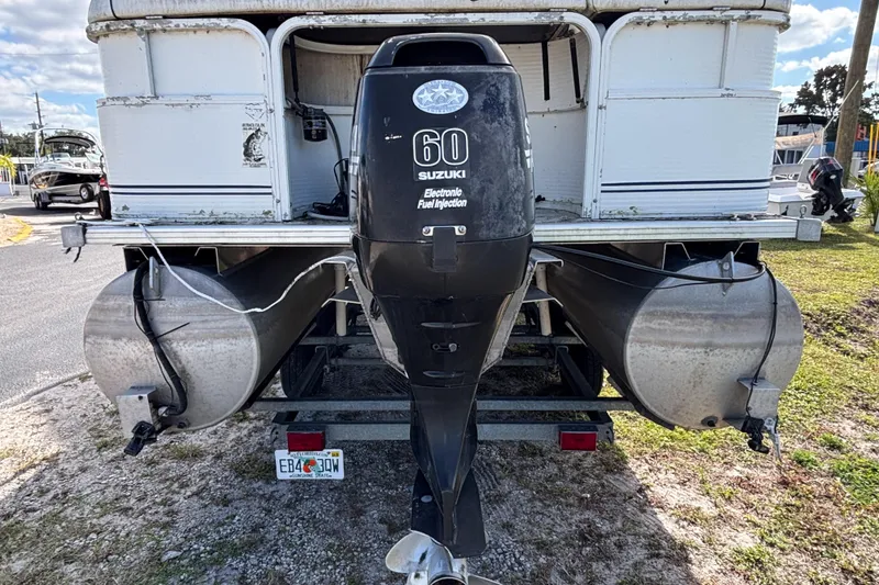 Slide: The Image of 2005 Bentley Pontoons 200 Fish with Suzuki 60 outboard motor, parked on a trailer. - 3