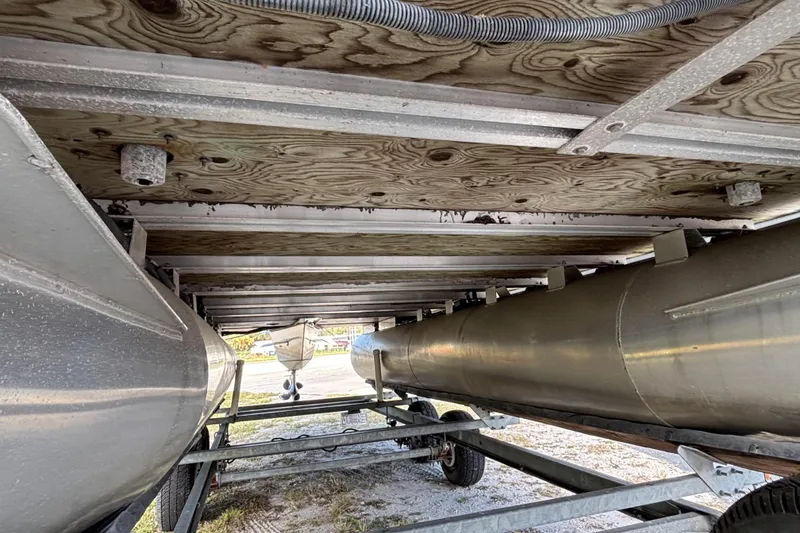 Slide: The Image of Underneath view of a 2005 Bentley Pontoons 200 Fish on a trailer. - 32