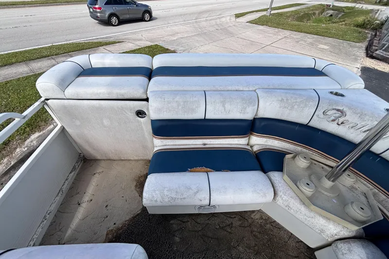 Slide: The Image of 2005 Bentley Pontoons 200 Fish interior with worn blue and white seating. - 35