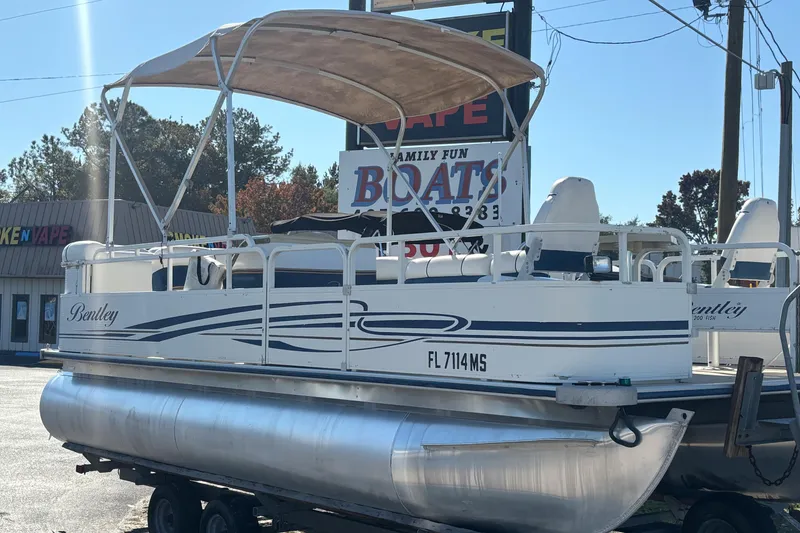 Slide: The Image of 2005 Bentley Pontoons 200 Fish boat with canopy, parked on trailer. - 44