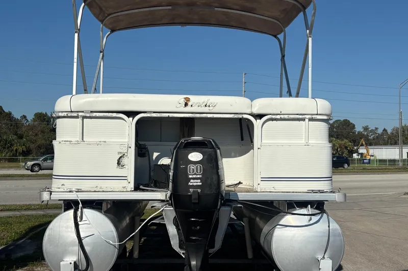 Slide: The Image of 2005 Bentley Pontoons 200 Fish with Suzuki 60 outboard motor, parked on roadside. - 48