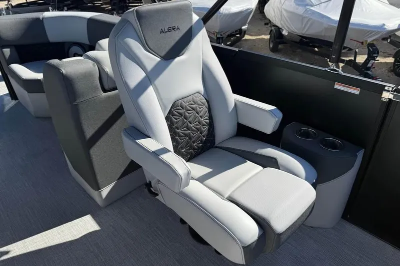 Slide: The Image of Luxurious Alera M 25Q 2026 boat seat with armrests and cup holders. - 11