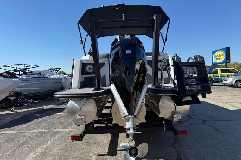 Slide: The Image of Alera M 25Q 2026 pontoon boat with powerful outboard motor at marina. - 7