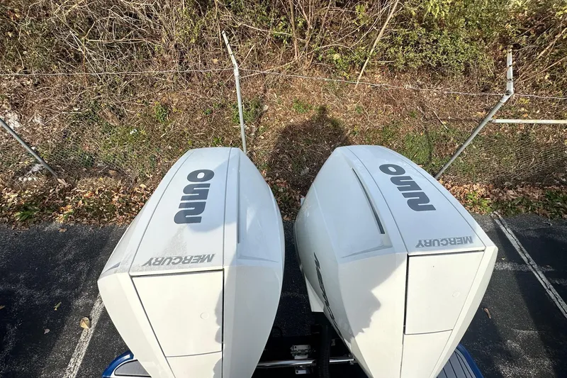 Slide: The Image of Overhead view of dual Mercury outboard engines on a 2019 Monterey 305SS Super Sport boat. - 16