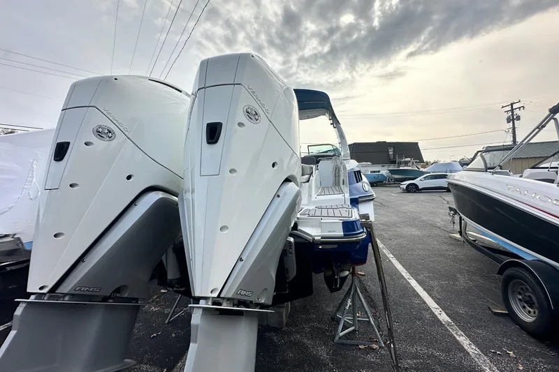 Slide: The Image of 2019 Monterey 305SS Super Sport boat with dual outboard engines in a marina setting. - 17