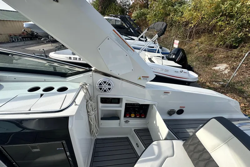 Slide: The Image of 2019 Monterey 305SS Super Sport boat interior with seating and control panel. - 24