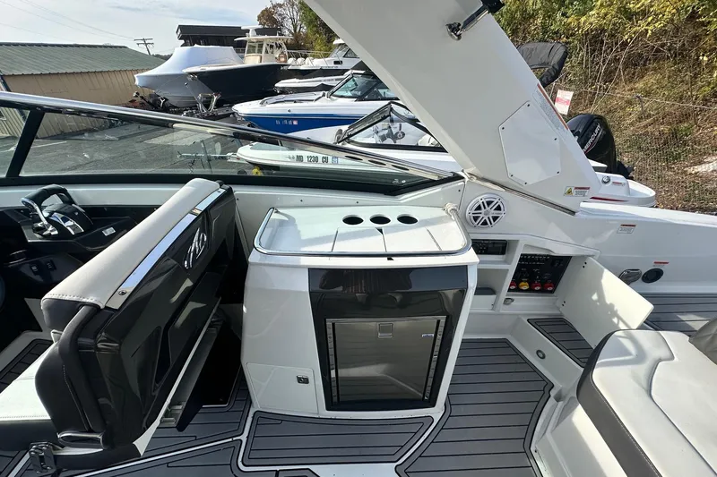 Slide: The Image of 2019 Monterey 305SS Super Sport boat interior with seating and control panel. - 29