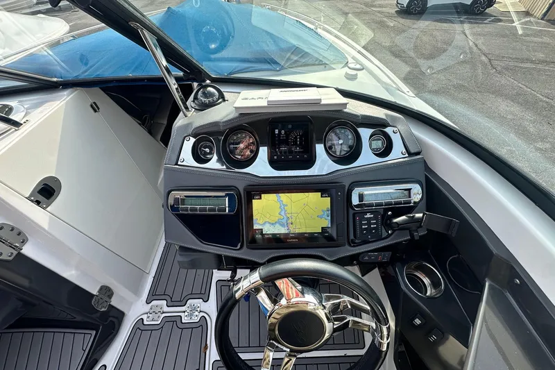 Slide: The Image of Cockpit of 2019 Monterey 305SS Super Sport boat with navigation system and controls. - 30