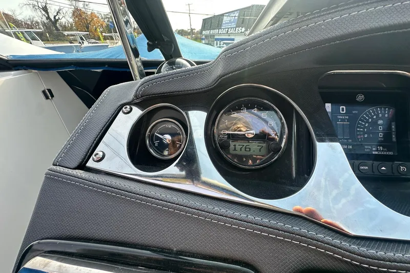 Slide: The Image of Dashboard of a 2019 Monterey 305SS Super Sport boat with gauges and controls. - 32