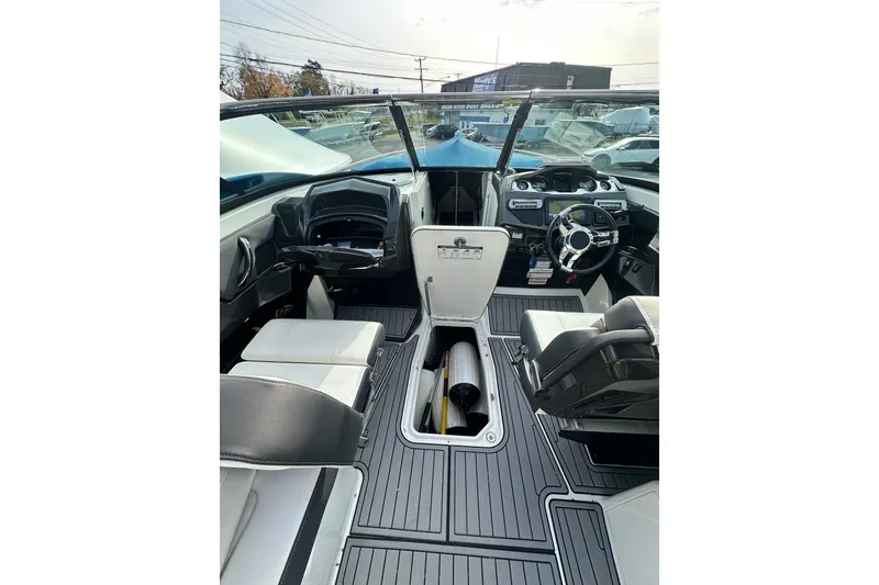 Slide: The Image of 2019 Monterey 305SS Super Sport boat interior with modern dashboard and seating. - 38